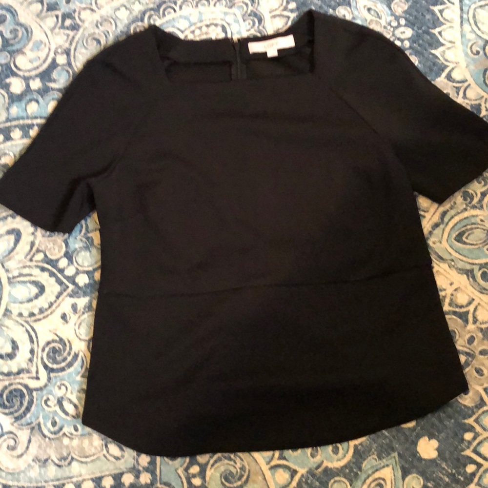 Black, poly top. Squared neckline, zipper back